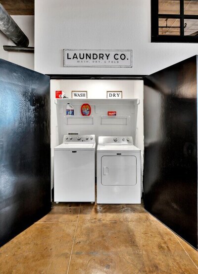 Washer and dryer included in this three-bedroom, two-bathroom industrial modern loft condo in the historic Behrens building in downtown Waco, TX.