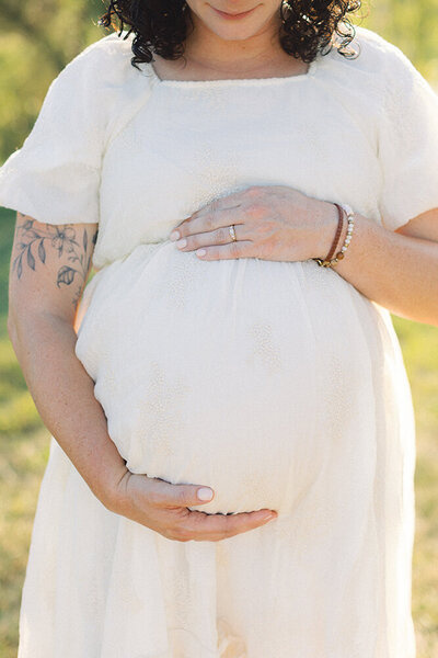 mom holding baby in belly