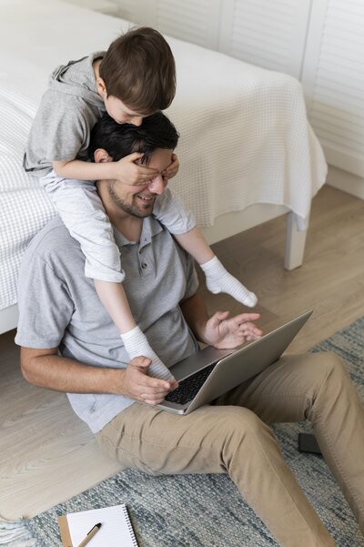 full-shot-father-working-floor-with-kid
