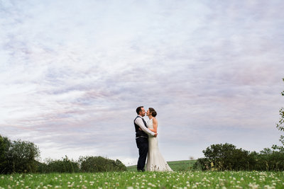 purple sky with wedding couple