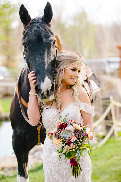 Jackson Hole photographers capture bride walking with horse