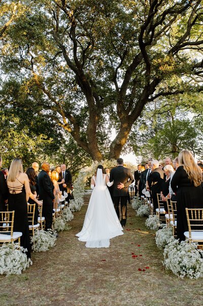 Back of bride and groom at their wedding ceremony