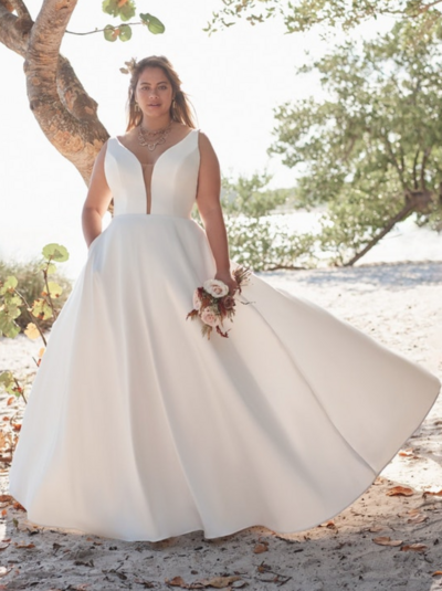 Keyhole Back Boho Sheath Wedding Gown. If you've got your heart set on boho, we can't help but steer you in the direction of gorgeous florals and a slinky-chic silhouette. For your consideration: this backless V-neck sheath wedding gown in nature-inspired perfection.