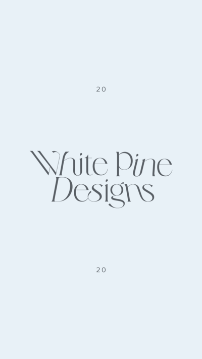 White Pine Designs logo on light blue background