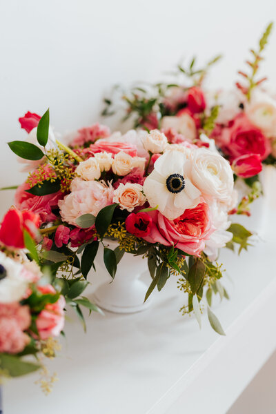 Close up of wedding florals with bridal hairpiece