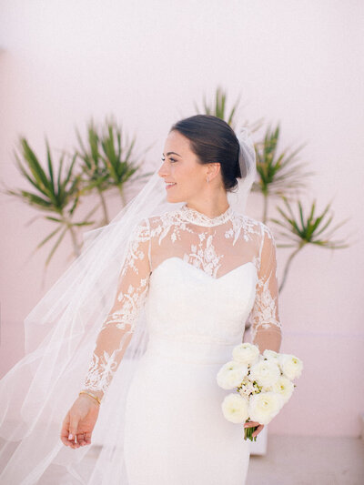 Bridal portrait against pink wall