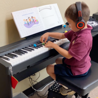 Children playing instruments in Preschool Music Class in Edmond Oklahoma