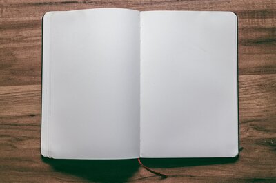 Journal opened to two blank pages for writing intentions