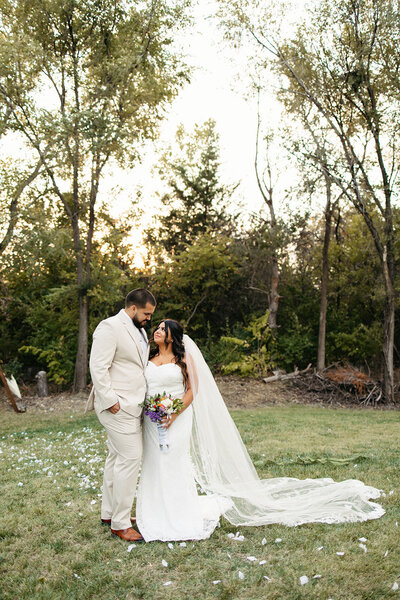 Bride and groom kiss as they exit their wedding ceremony in Wichita kansas - ashley cole photography