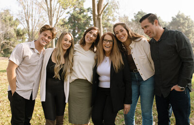 family of 6 smiling together