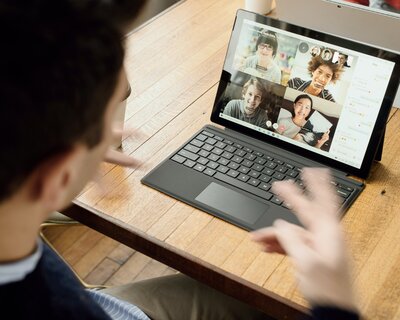 Man talking on video chat with friends