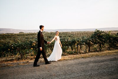 Couple Walking Together in Vineyard - Sarah & Alan | Gilbert Cellars Hackett Ranch Winery Wedding Yakima Washington