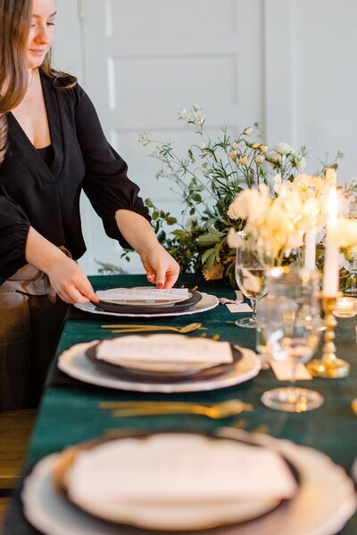 Michigan wedding planner designing a reception table.