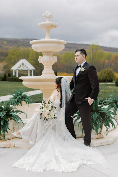 A classy tablescape with hanging cloth and floral accents cascading down the center table