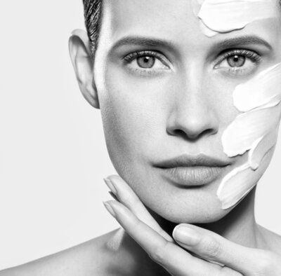 A woman is getting a facial treatment at a beauty salon
