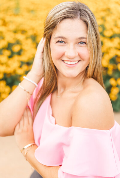 girl smiling in a pink top