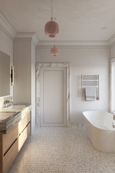 Top Boston interior designers renovated a brownstone primary bath with an oak vanity, freestanding tub, and marble trim, blending modern comfort with classic architecture.