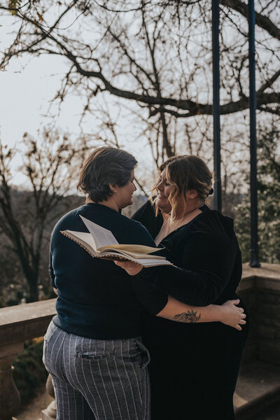 Two newlyweds embrace at the altar of their outdoor elopement