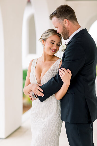 Couple stand outdoors looking at each other