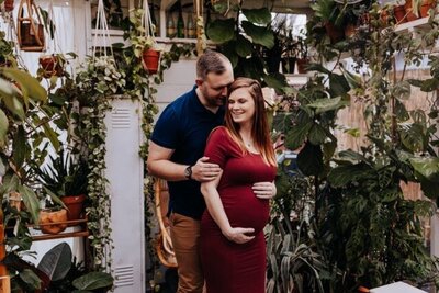 Nashville newborn photographer captures man hugging woman during maternity photos