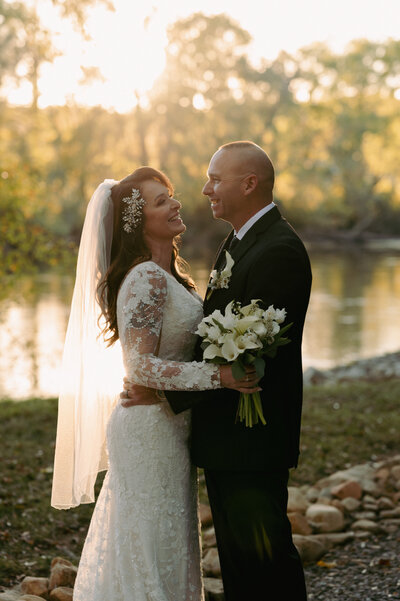 A bride and groom dip for a kiss at the end of their ceremony.