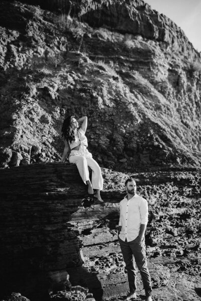 Black and white photo of couple posing in desert