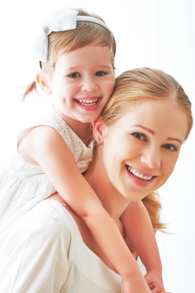 Thrive by Spectrum Pediatrics image for contact us form is a child and mother smiling together