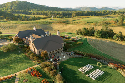 Drone view of Charlottesville mountains and white barn at Castle Hill Cider