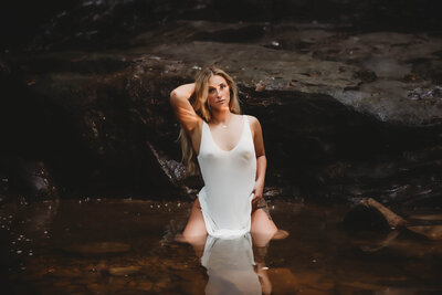 woman posing in water for bucyrus ohio boudoir photographer reva davis photographyr