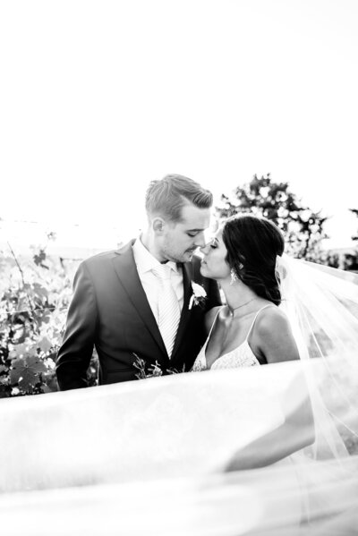 Black and white wedding portrait of bride and groom.