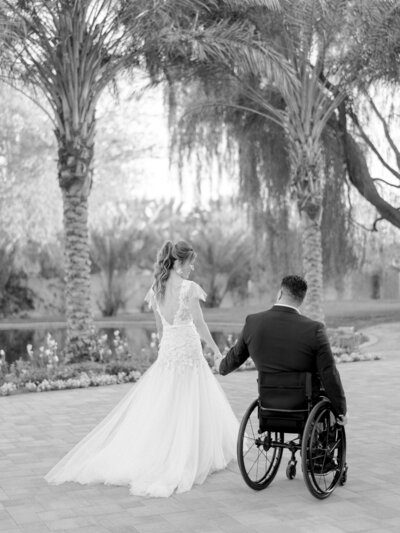 Photographer, Tiffany Gentry, walks with her husband on their wedding day