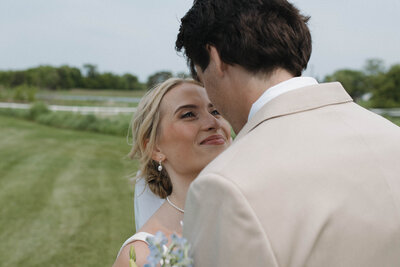 A close up shot of a bride and groom staring lovingly into each other's eyes during their wedding portraits. Captured by a Minnesota Wedding Photographer specializing in intimate, documentary style weddings