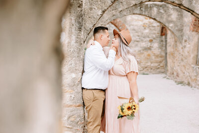 Couple taking engagement photos at San Antonio Missions Historical Park