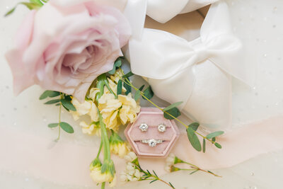 Frozen Moments by Kathy Photography | pink roses-ring set-white wedding shoes photo