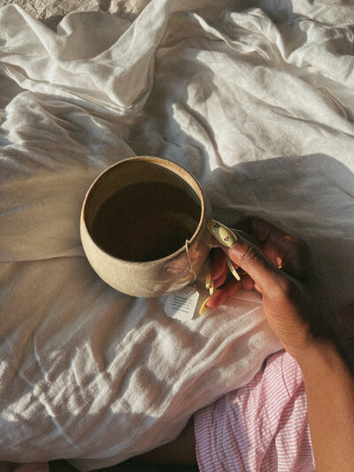a woman enjoying her coffee on a wellness retreat in Santa Monica