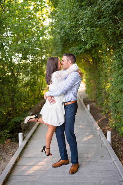 Milwaukee engagement photography of couple hugging and laughing