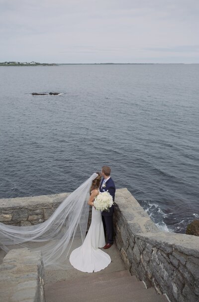 Bride and Groom overlook the Atlantic Ocean in Newport. Deborah Zoe Photography.