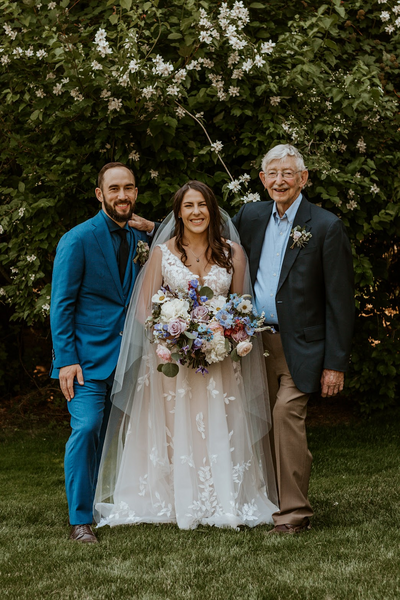Trisha with her groom and grandpa on her wedding day.