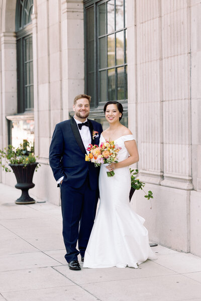 A bride touching a groom's face