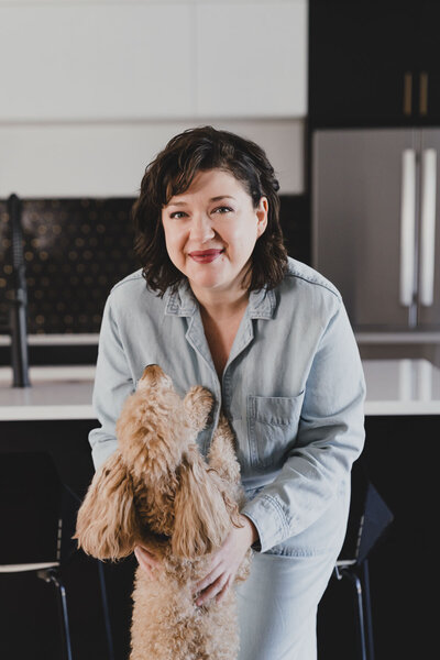 Desiree Peterson holding her Poodle