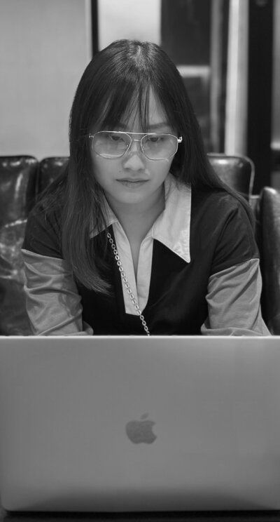 Founder of AZ Digital Solutions focused on building client websites and automation funnels on a laptop