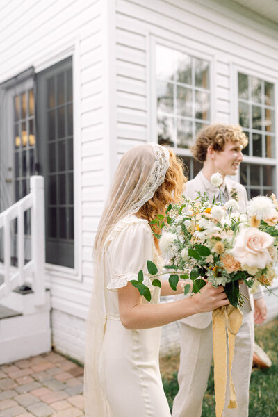 Peyton Curry and Jon take a romantic stroll through their backyard wedding venue in Richmond, VA, captured by a documentary-style wedding photographer.
