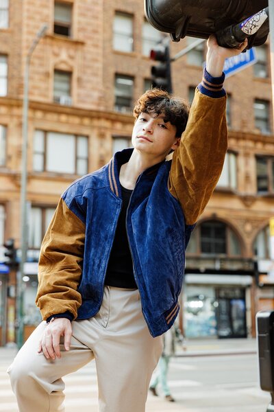 Urban senior pictures for guys captured in Los Angeles with natural light and a cool, casual street-style wardrobe
