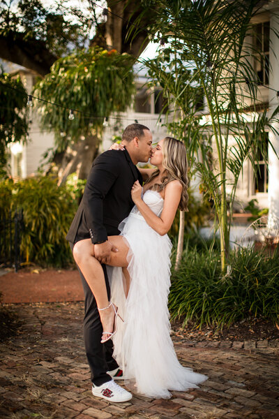 couple dip kissing during engagement session
