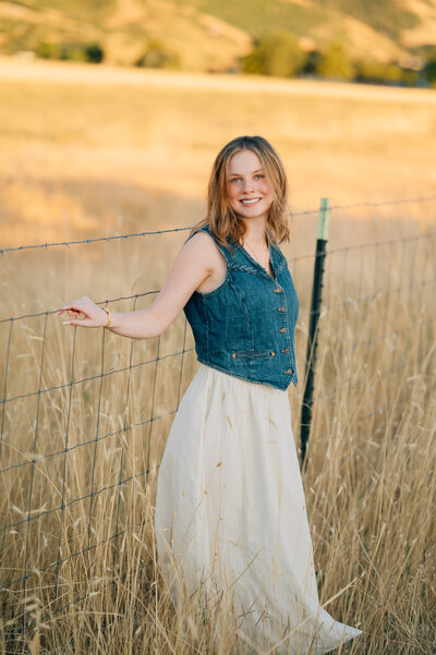 Couple kissing while kids are looking at flowers in Little Cottonwood Canyon, Utah