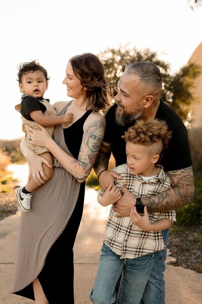 Family of four posing together