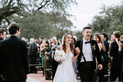 Photo of Bride and Groom during  recessional in Spring Branch Texas
