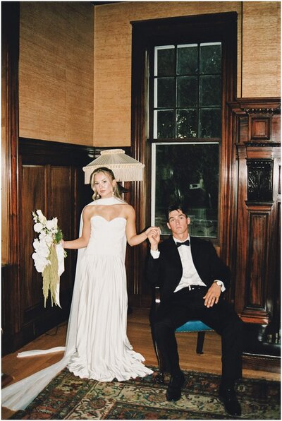 bride and groom pose for a film photo