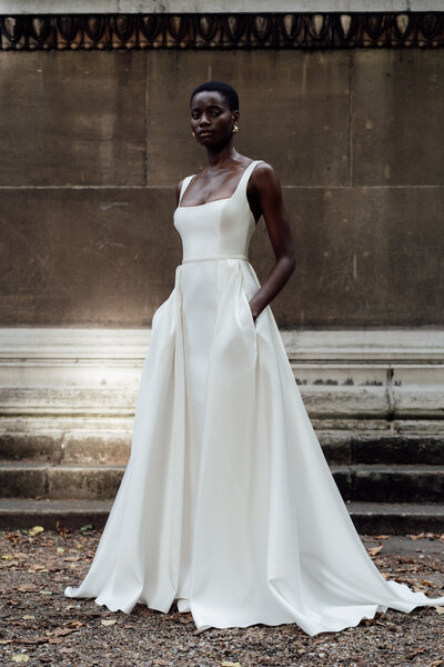 black and white image bride wearing feathered wedding dress