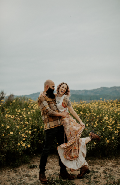 couple dancing in field